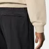 Weit geschnittene Jogginghose mit Druckknopf- und Reißverschlusstaschen